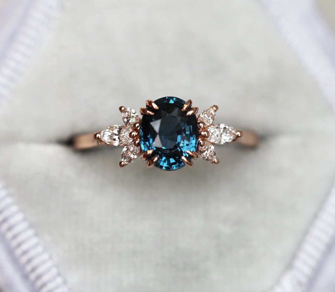 Oval-shaped blue ceylon sapphire ring with side diamonds