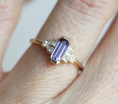 Octagon-shaped emerald-cut lavender sapphire ring with white side diamonds