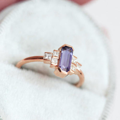Octagon-shaped emerald-cut lavender sapphire ring with white side diamonds
