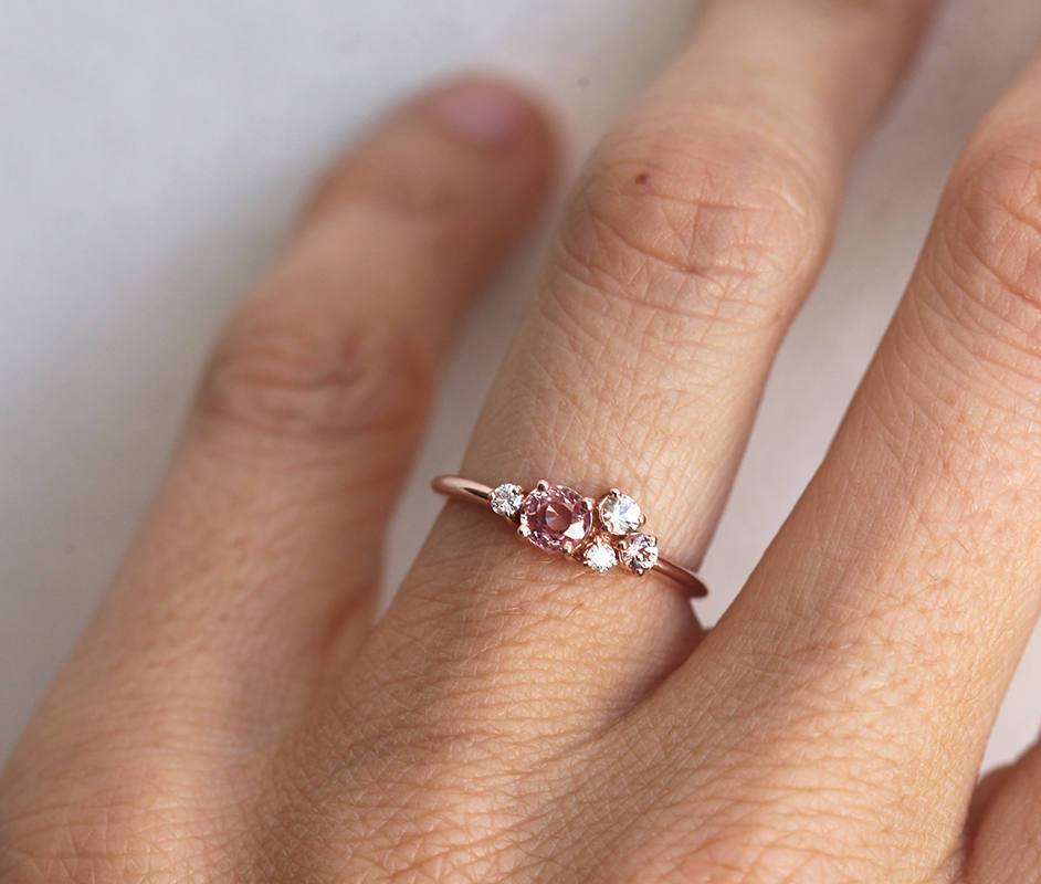 Round peach pink sapphire cluster ring with diamonds