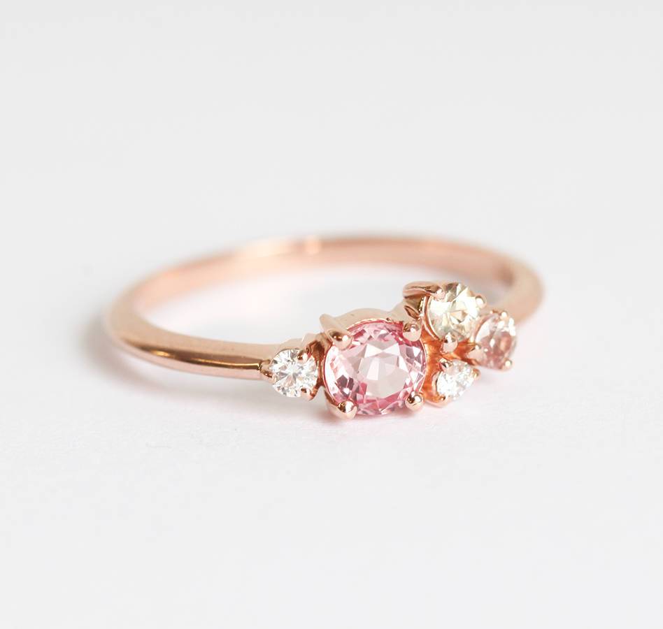 Round peach pink sapphire cluster ring with diamonds