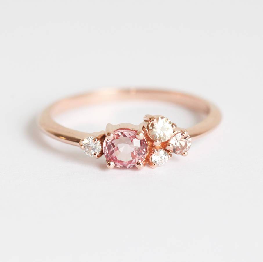 Round peach pink sapphire cluster ring with diamonds