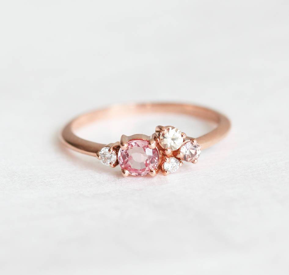 Round peach pink sapphire cluster ring with diamonds