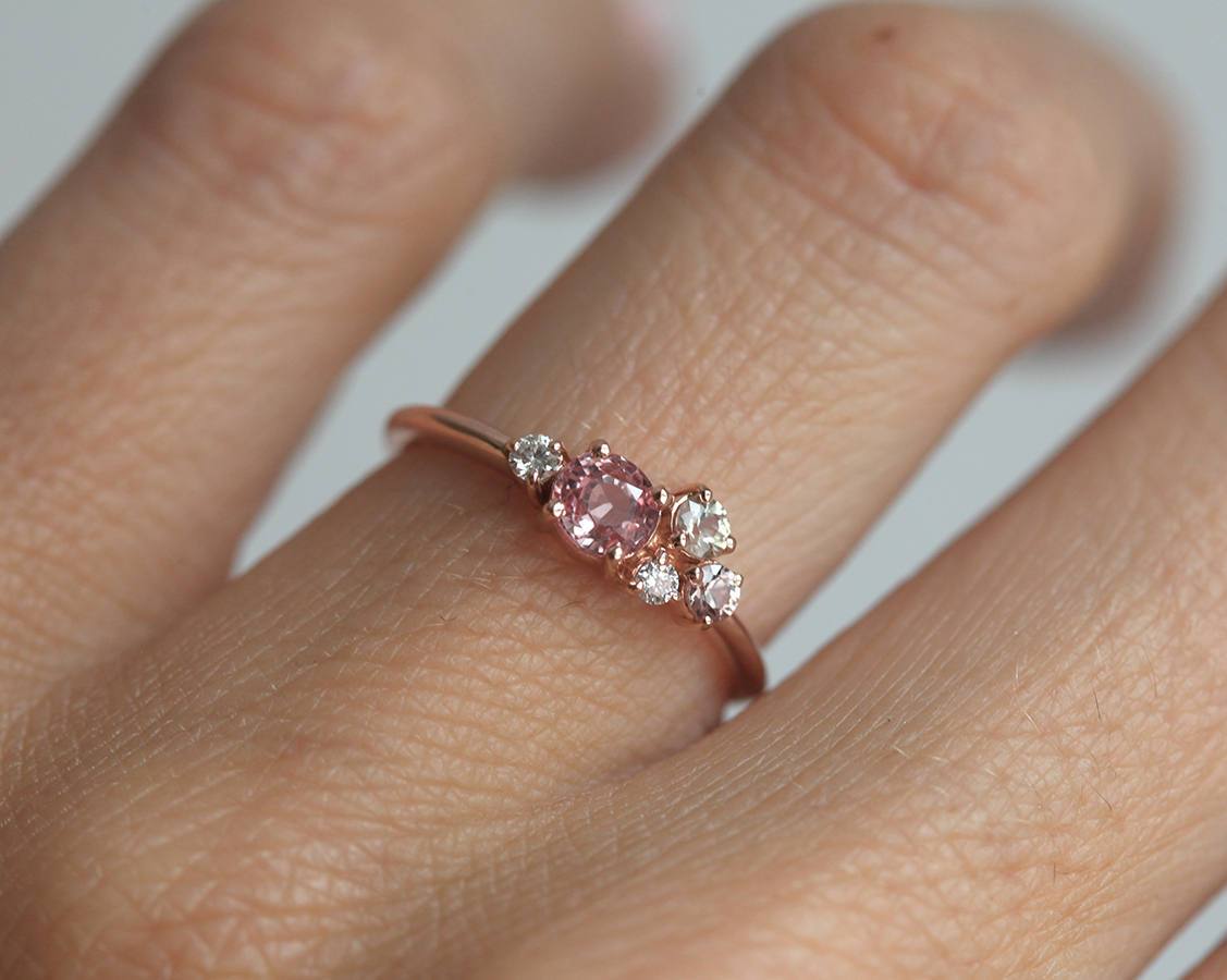 Round peach pink sapphire cluster ring with diamonds