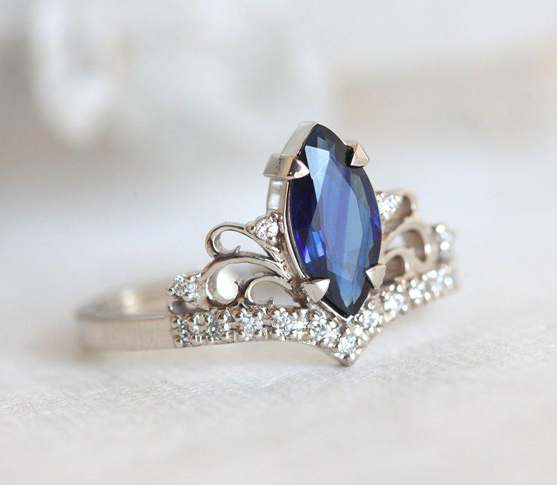 Vintage blue marquise-cut sapphire with side diamonds