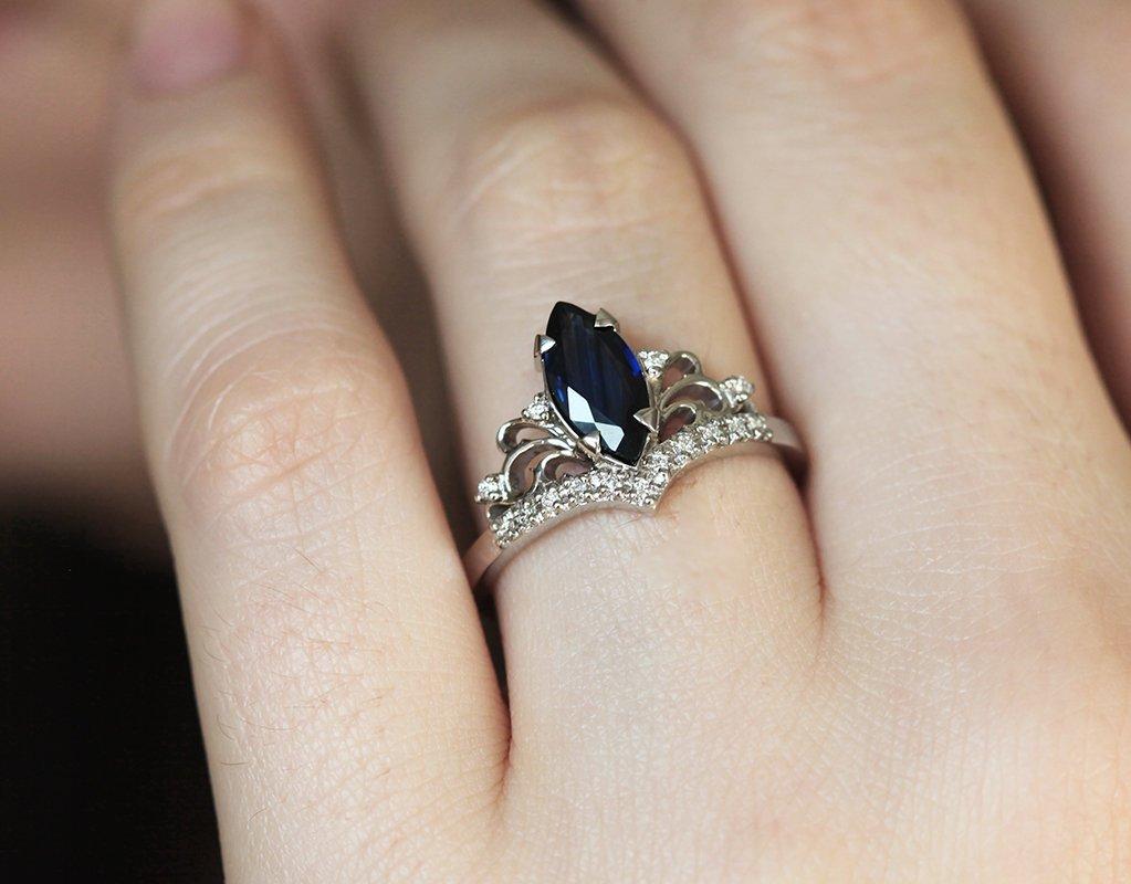 Vintage blue marquise-cut sapphire with side diamonds