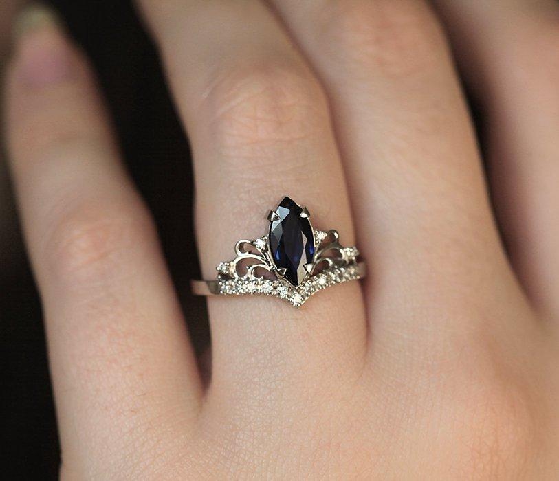 Vintage blue marquise-cut sapphire with side diamonds