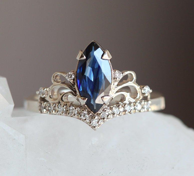 Vintage blue marquise-cut sapphire with side diamonds