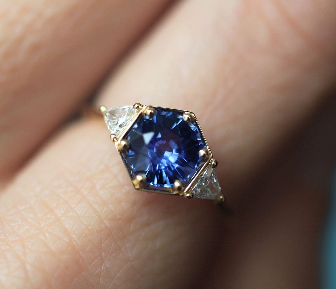 Round blue sapphire ring with white side diamonds