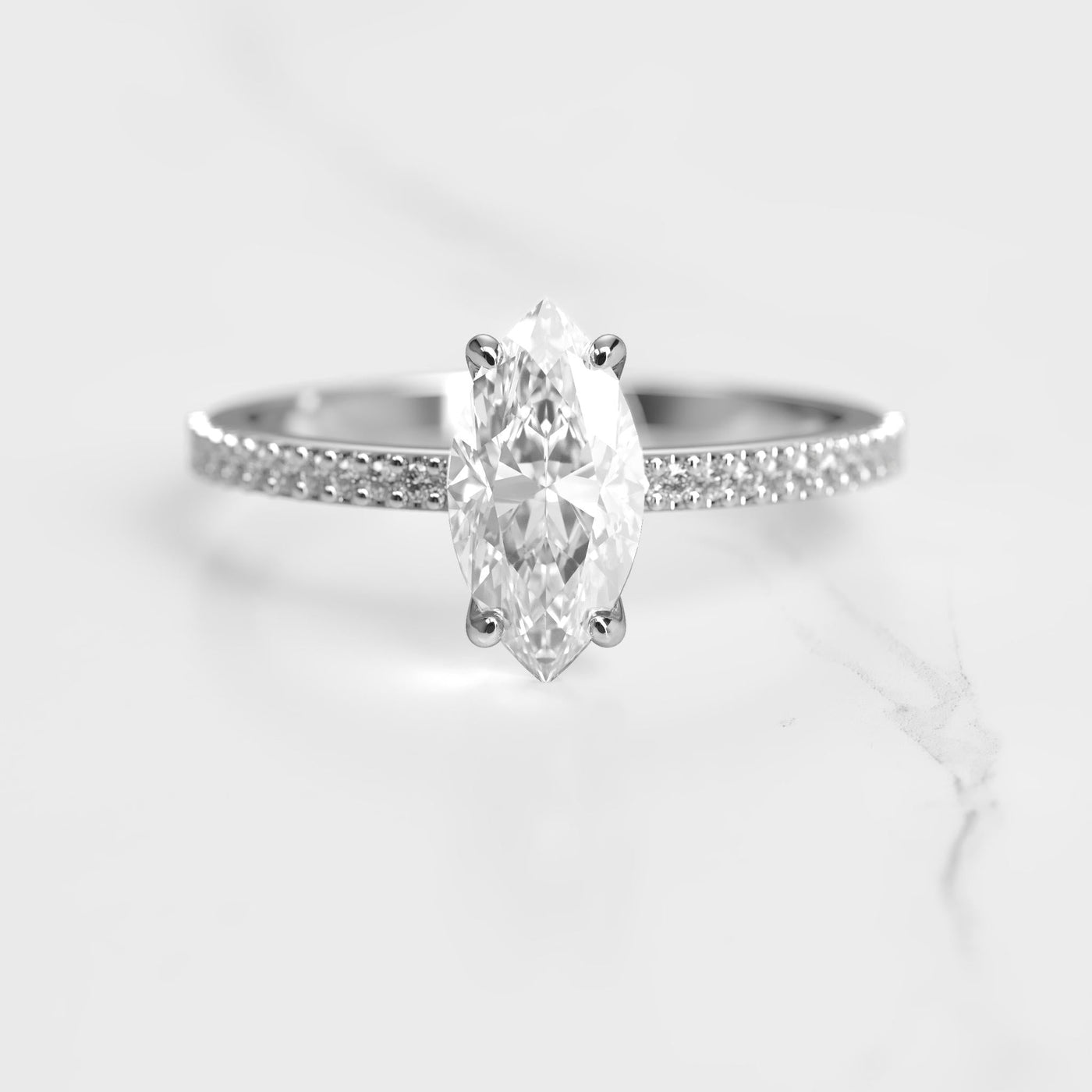 Marquise half pave solitaire diamond ring