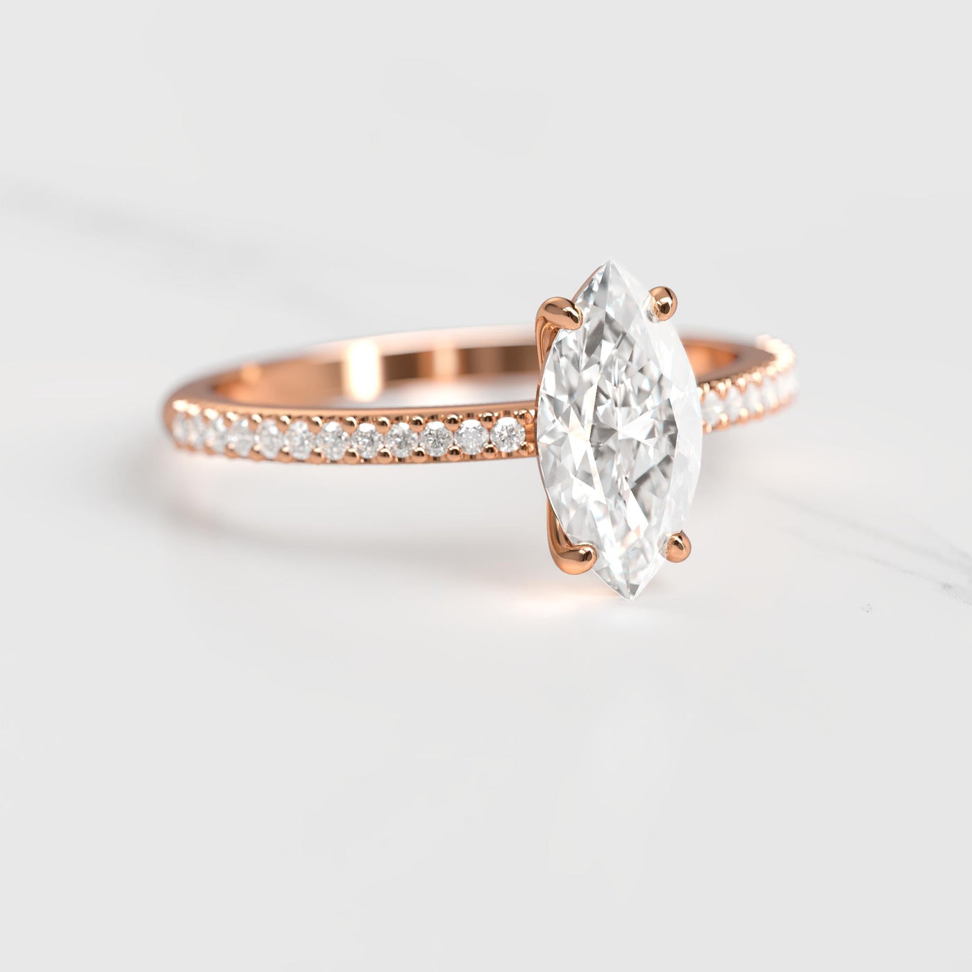Marquise half pave solitaire diamond ring