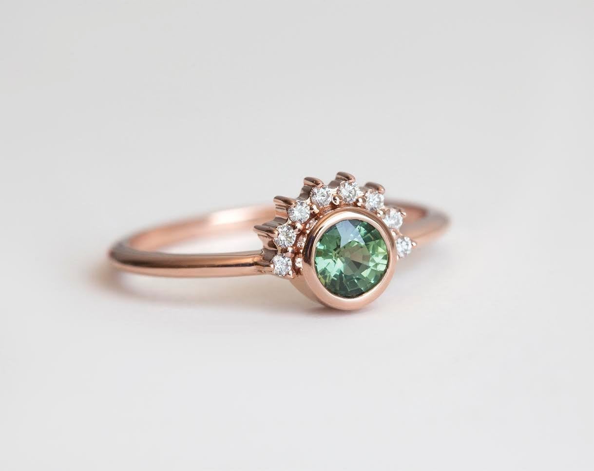 Round green sapphire ring with diamond halo