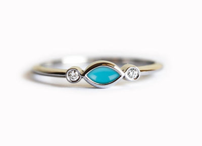 Marquise-cut blue turquoise engagement ring with white side diamonds