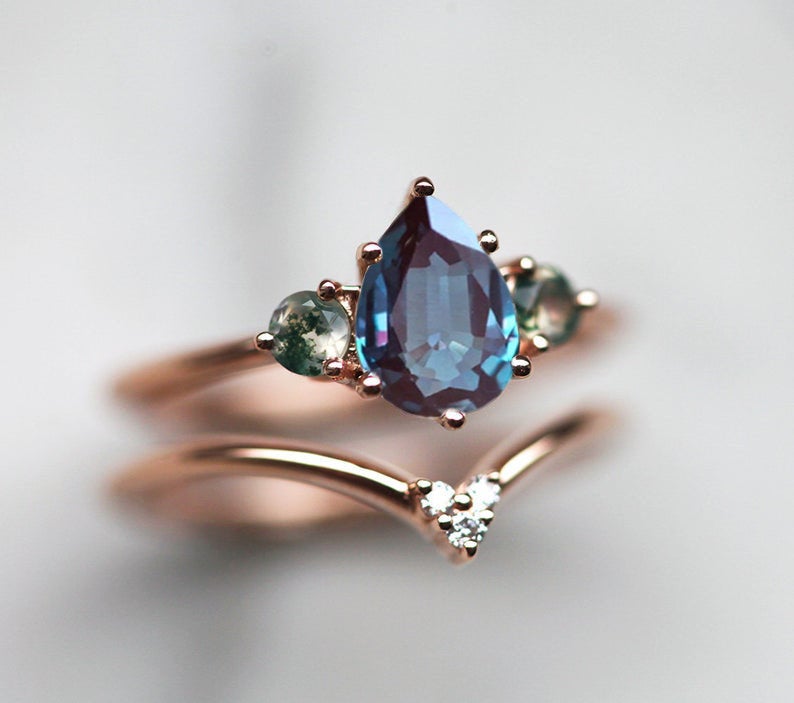 Teal Pear Alexandrite Ring with 2 Side Round Moss Agate Stones with Complementary V-Shaped Diamond Band