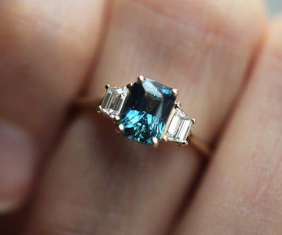 Radiant-cut sapphire ring with side diamonds