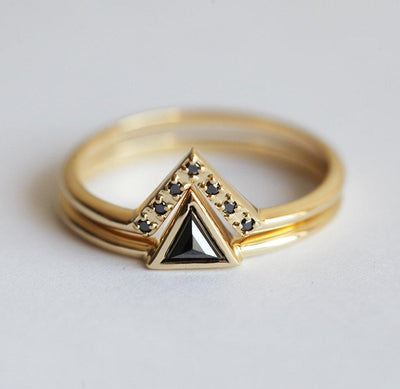 Triangle-shaped black diamond ring and white diamond v-shaped ring