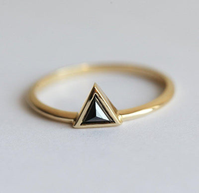 Triangle-shaped black diamond ring and white diamond v-shaped ring