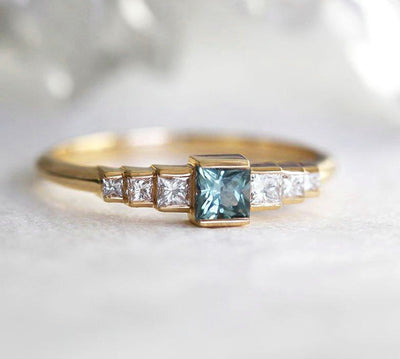 Square-shaped teal sapphire art-deco ring with white side diamonds