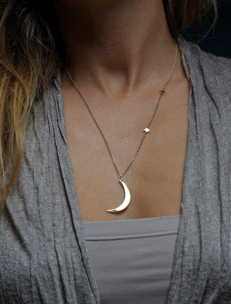 Gold necklace with crescent moon and stars