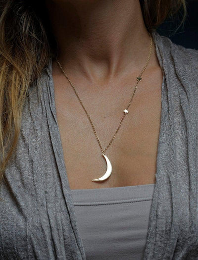 Gold necklace with crescent moon and stars