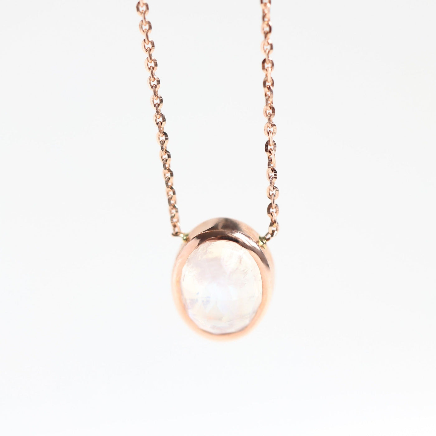 Gold chain with white oval moonstone