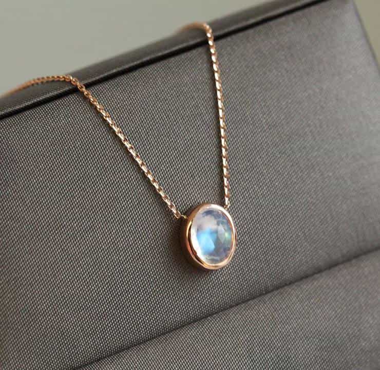 Gold chain with white oval moonstone