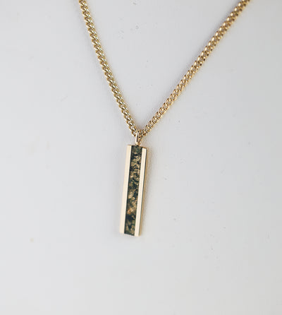 Men's bar necklace featuring a sleek 14K gold pendant with a moss agate inlay, showcasing natural green and earthy patterns on a sturdy chain.