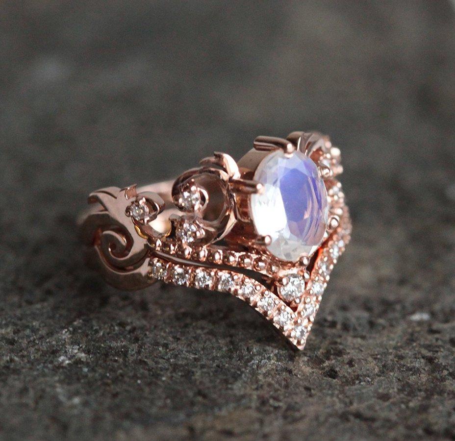 Vintage ring featuring oval-cut Moonstone and white Diamonds in 14k rose gold.