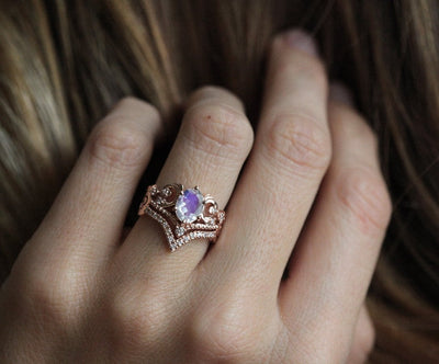 Elegant Moonstone Ring Set with oval-cut Moonstone and white Diamonds on a hand.