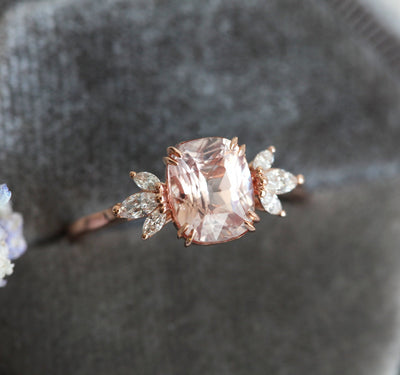 Cushion-cut peach sapphire cluster ring with diamonds