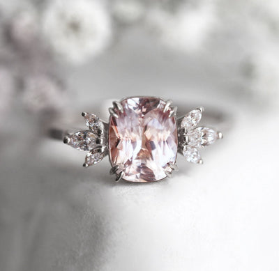 Cushion-cut peach sapphire cluster ring with diamonds