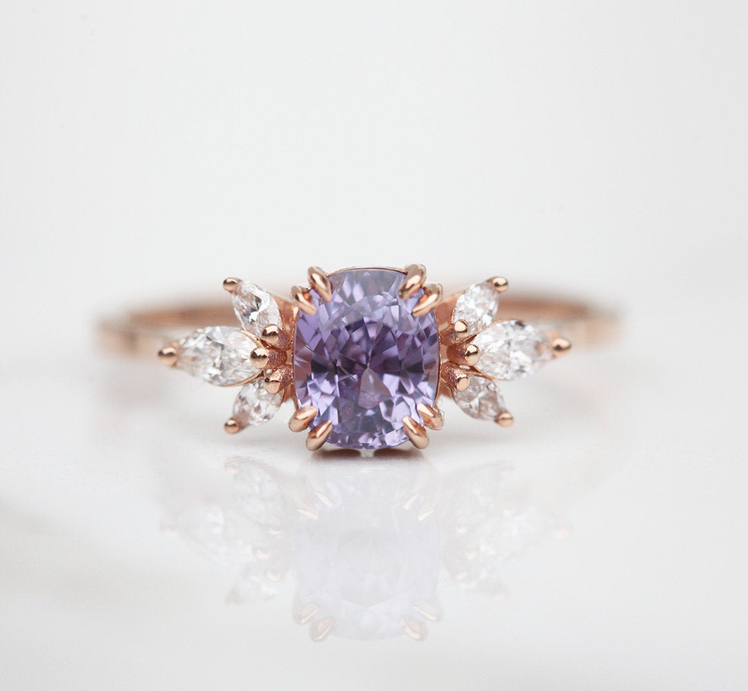 Cushion-cut blue lavender sapphire cluster ring with white diamonds
