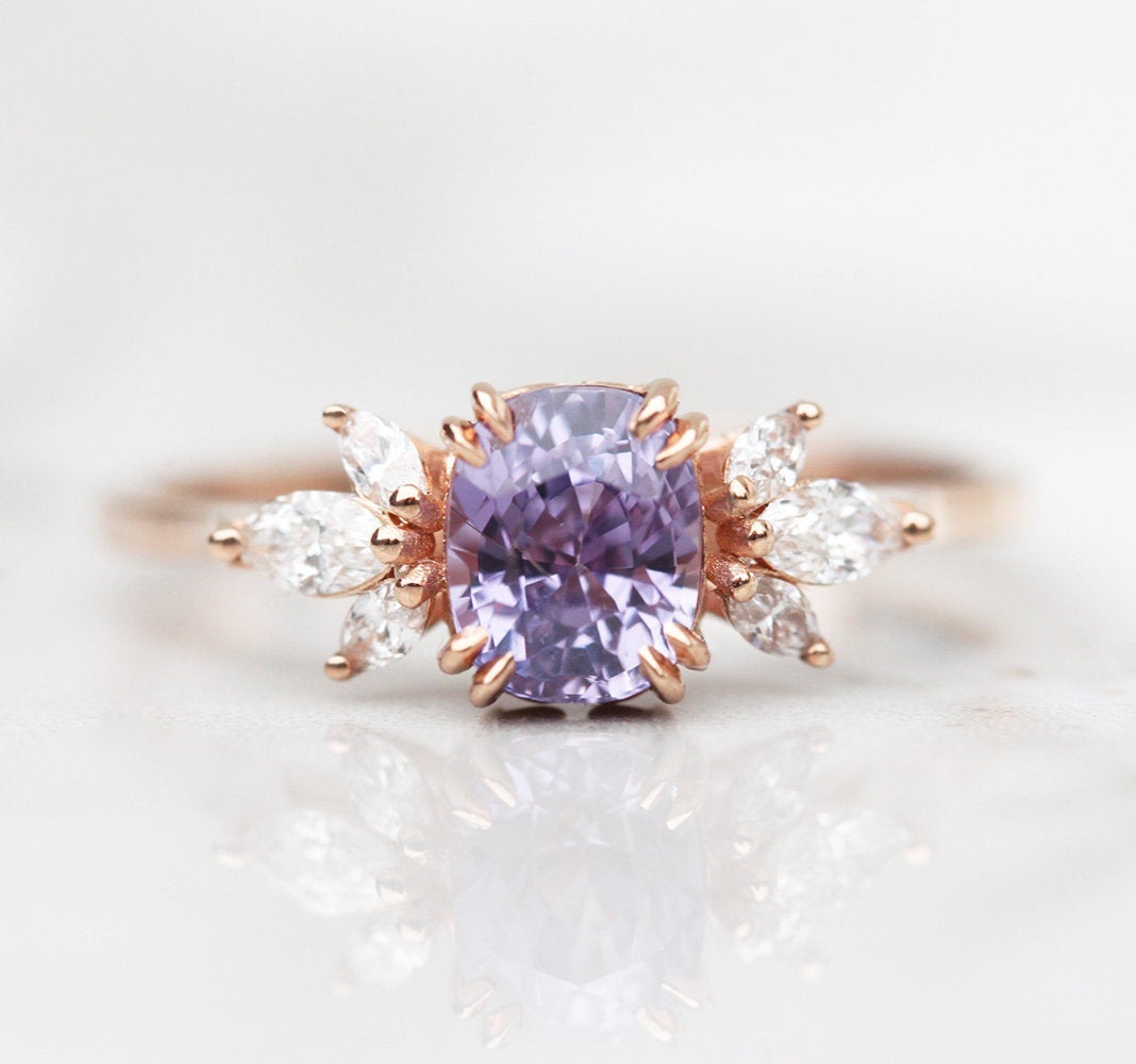 Cushion-cut blue lavender sapphire cluster ring with white diamonds