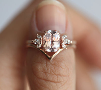 Cushion-cut peach sapphire cluster ring with diamonds