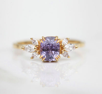 Cushion-cut blue lavender sapphire cluster ring with white diamonds