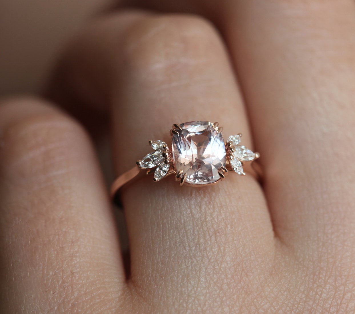 Cushion-cut peach sapphire cluster ring with diamonds