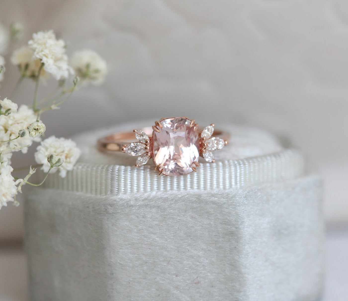 Cushion-cut peach sapphire cluster ring with diamonds