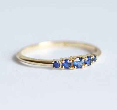 Round blue sapphire cluster ring