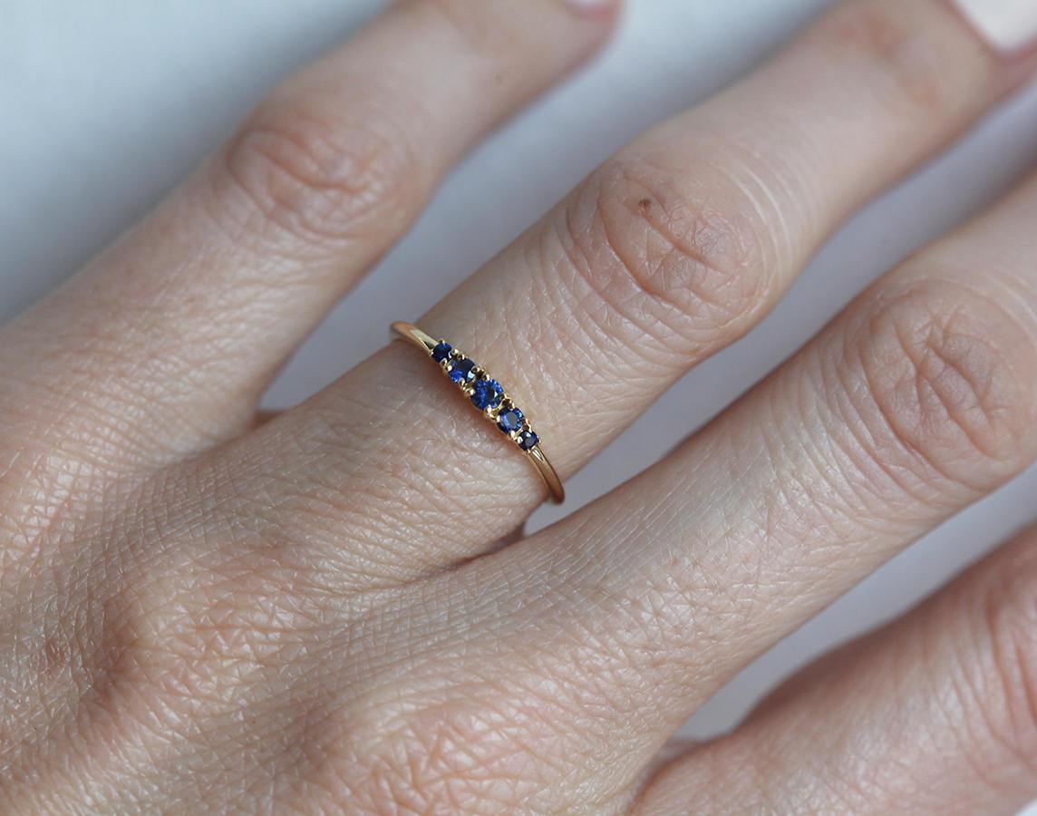 Round blue sapphire cluster ring