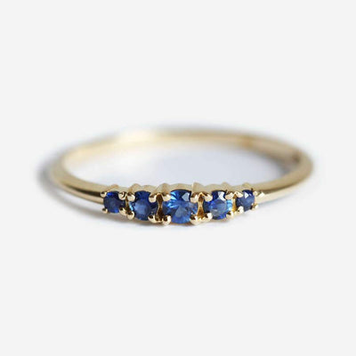 Round blue sapphire cluster ring