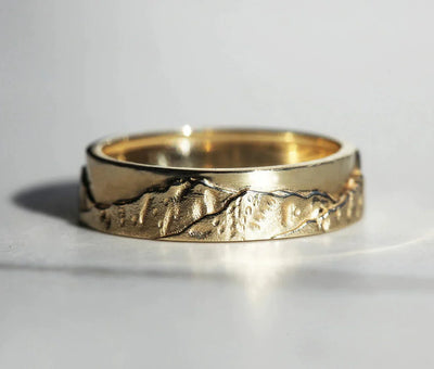 Gold ring with custom mountain engrave
