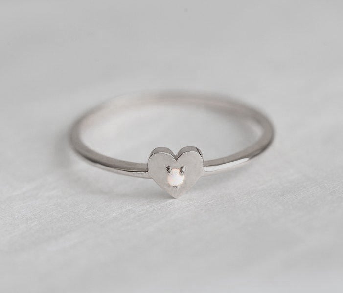 White Round Opal Heart Shape Ring with the Gemstone positioned in the middle