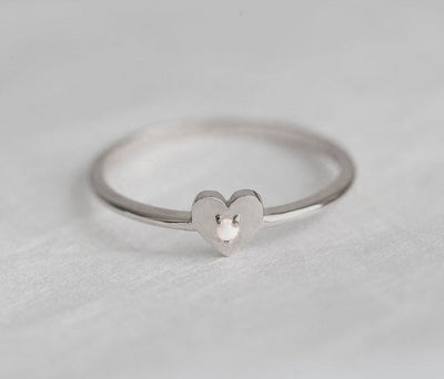 White Round Opal Heart Shape Ring with the Gemstone positioned in the middle