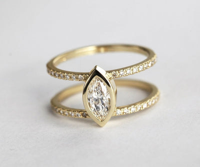 Marquise-cut diamond ring with two diamond pave bands