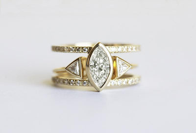 Marquise-cut diamond ring with two diamond pave bands