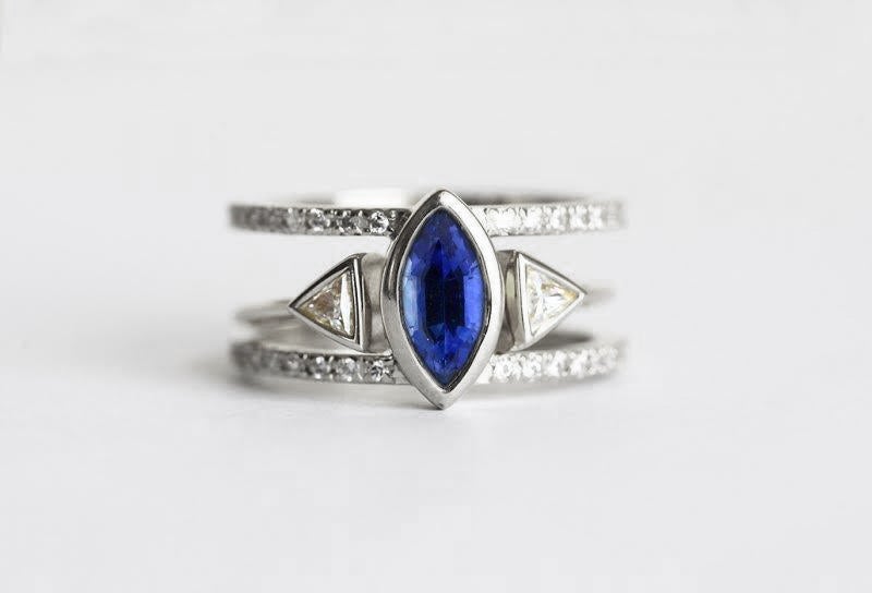 Marquise-cut blue sapphire open band engagement ring with side diamonds