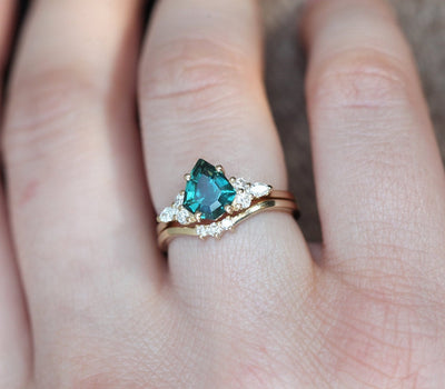 Pear-shaped blue green sapphire cluster ring with diamonds
