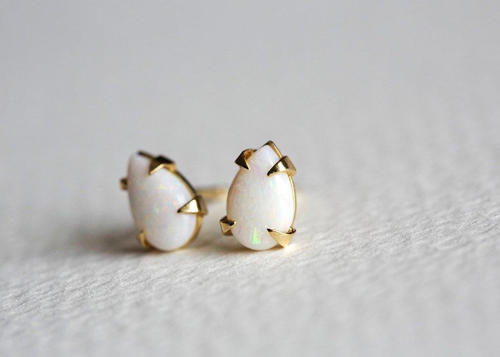 Pear-shaped white opal stud gold earrings