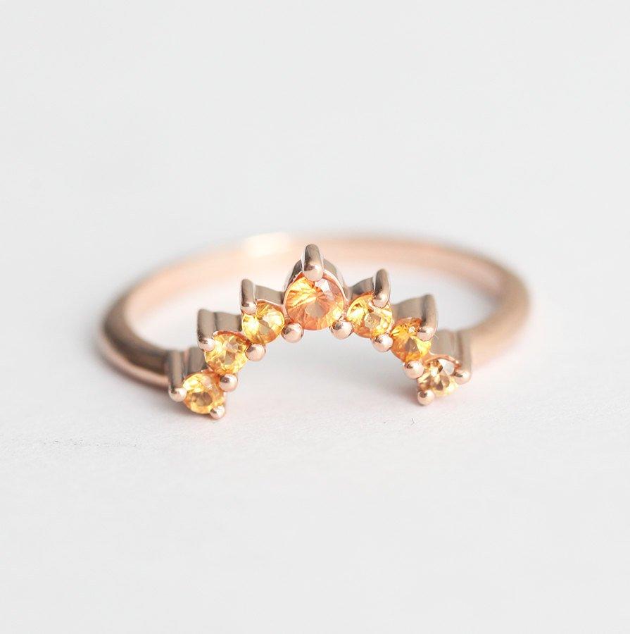 Round yellow orange sapphire ring with nested sapphires