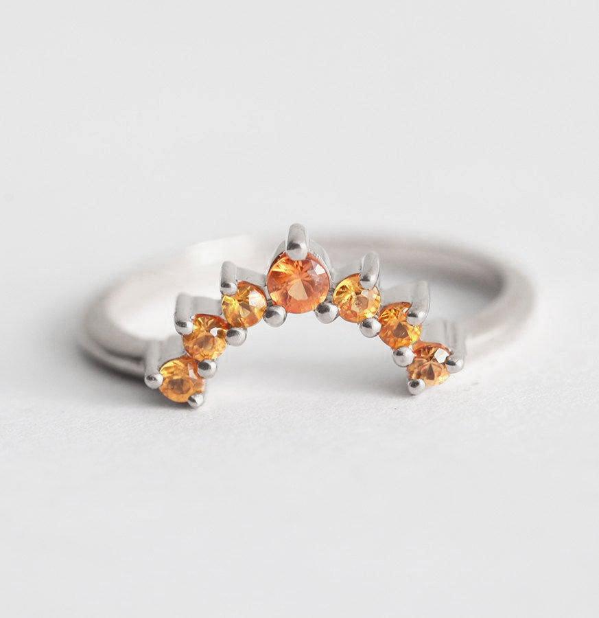 Round yellow orange sapphire ring with nested sapphires